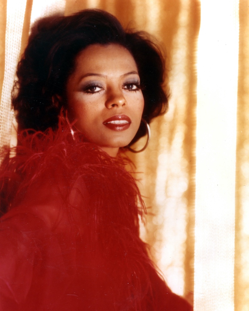 Diana Ross in 1970 wearing hoop earrings and a red outfit. | Photo Credit: Pictorial Press Ltd / Alamy Stock Photo