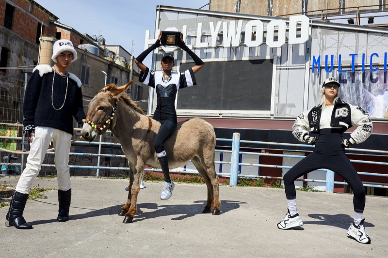 Models pose with a donkey for Dolce & Gabbana fall-winter 2021 campaign.