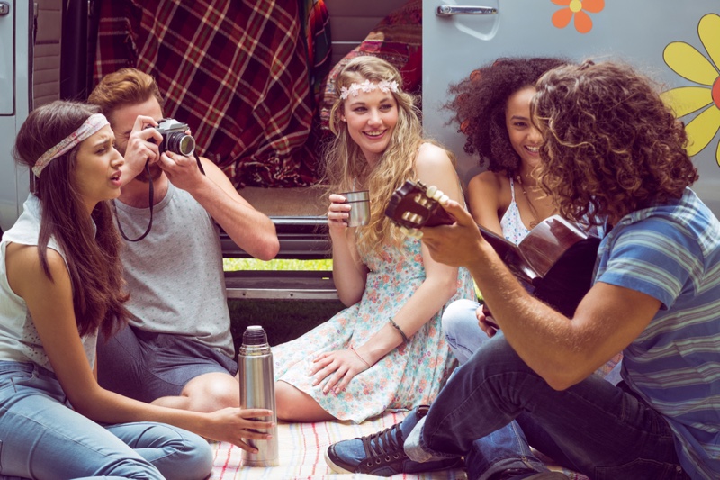 Hipster Group Festival Camper Playing Guitar