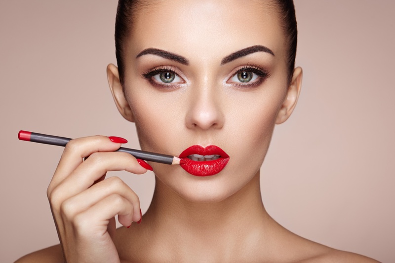 Model Applying Red Lip Liner Lipstick Makeup Beauty