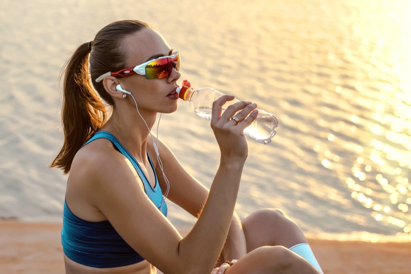 Model Drinking Water Activewear Style Visor Sunglasses