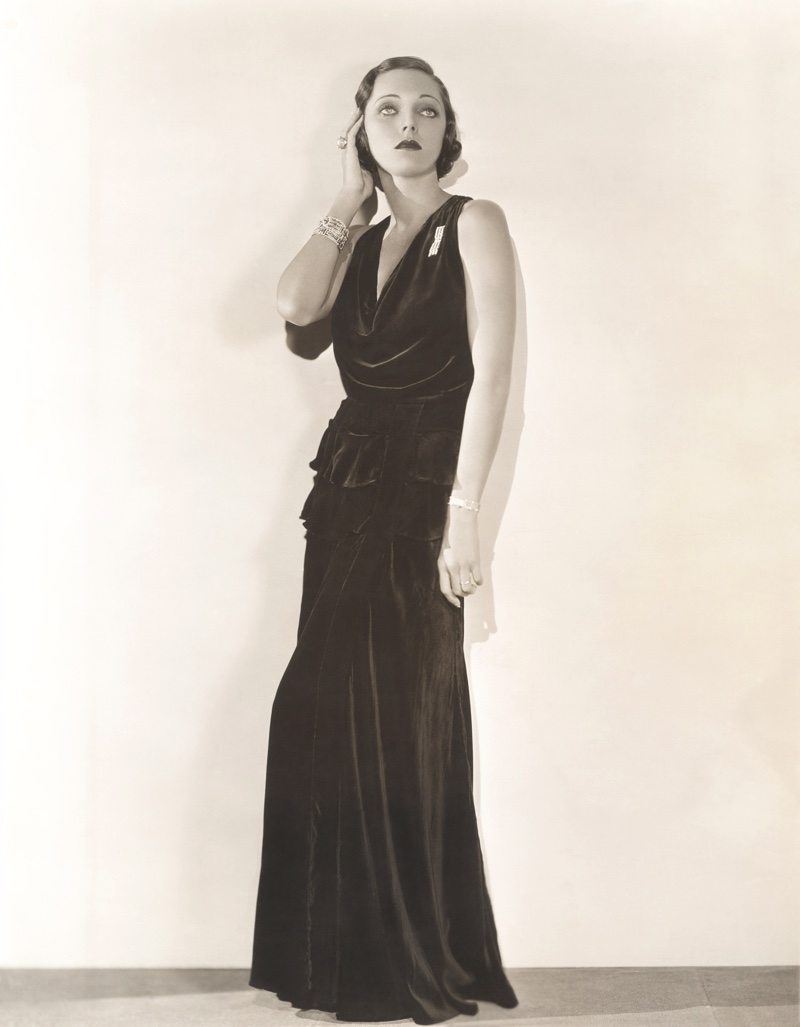 Model poses in long column dress with a defined waist for a 1930s look. Photo: Shutterstock.com