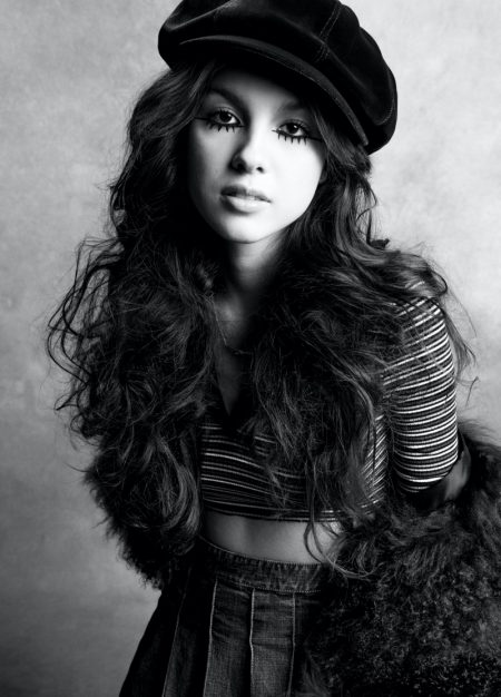 Olivia Rodrigo Wears Retro Style for V Magazine Singer Olivia Rodrigo poses in GUESS Originals top, GUESS Vintage skirt, Eric Javits hat, and Tiffany & Co. necklace. Image: Courtesy of V Magazine / Inez & Vinoodh
