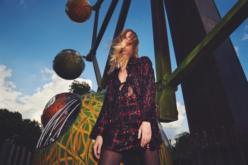 Lexi Boling poses at an amusement park for Pinko fall-winter 2021 campaign.