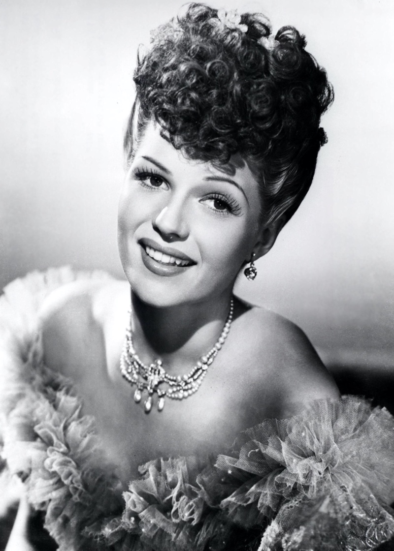 Rita Hayworth stuns in a dramatic updo featuring pin curls in 1940. Photo: ZUMA Press, Inc. / Alamy Stock Photo