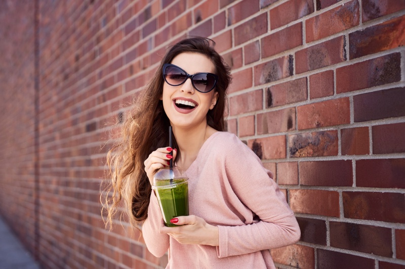 Smiling Woman Green Smoothie Pink Top