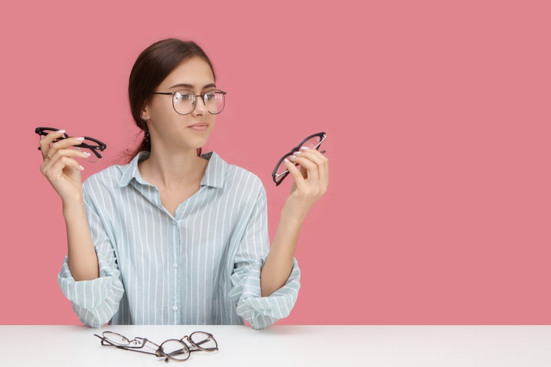 Woman Choosing Looking Different Eye Glasses