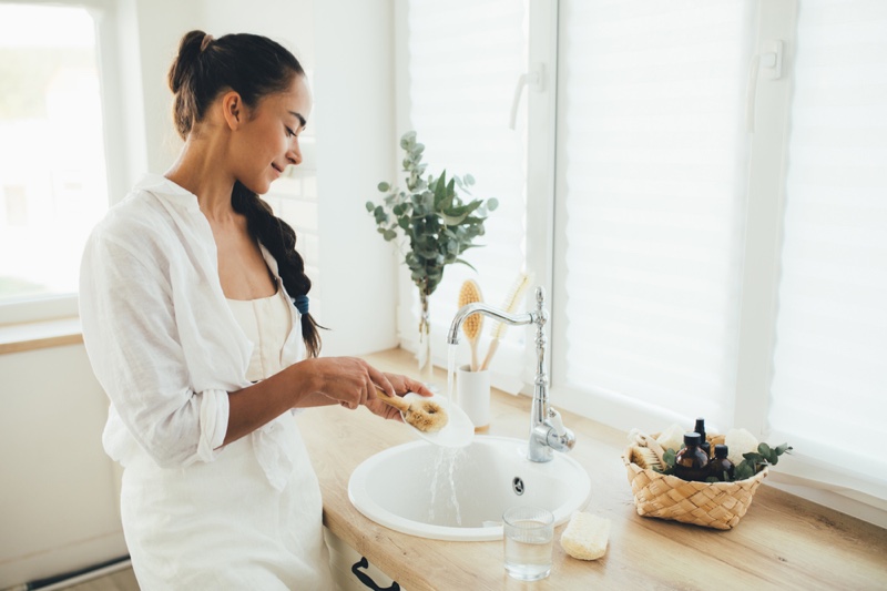 Woman Cleaning Dishes Natural Home