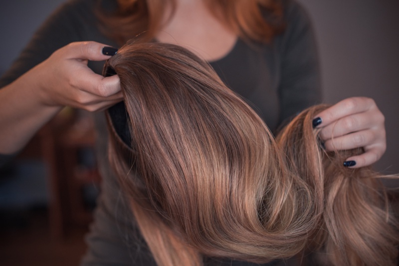 Woman Holding High Quality Wig