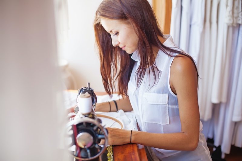 Woman Sewing Clothes