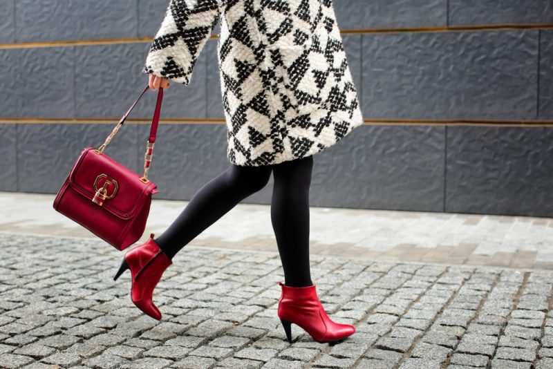 Woman Wearing Red Boots with Red Bag
