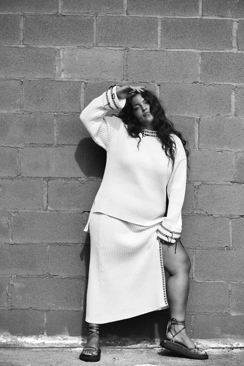 Paloma Elsesser poses in Zara Whip Stich Knit Sweater & Ribbed Knit Skirt.