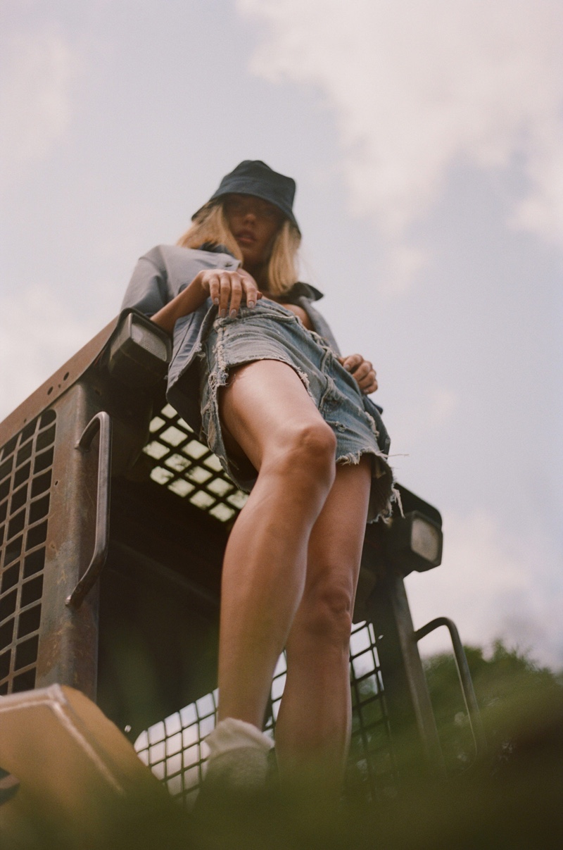 Vintage Coat, Levi’s Shorts, Bass Shoes, and Pretty Green Hat. Photo: Conrad Dornan