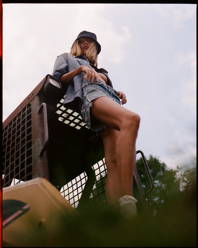 Vintage Coat, Levi’s Shorts, Bass Shoes, and Pretty Green Hat. Photo: Conrad Dornan