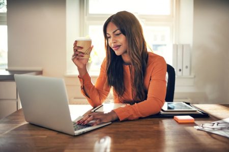 Spending Too Much Screen Time at Work? Here's Some Advice Black Woman Laptop Coffee Sunlight Work