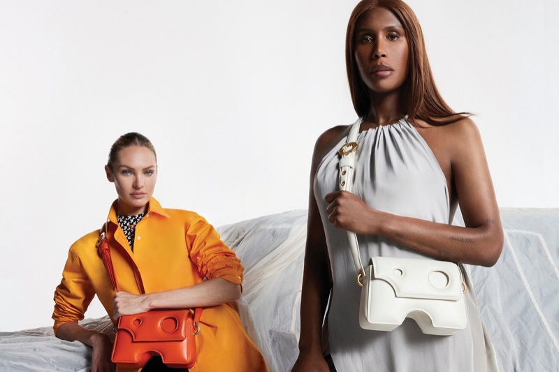 Candice Swanepoel and Honey Dijon pose with the Off-White Burrow bag.