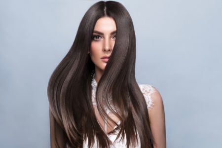 What to Know About Nano Bead Vs. Weft Hair Extensions Woman Wearing Hair Extensions