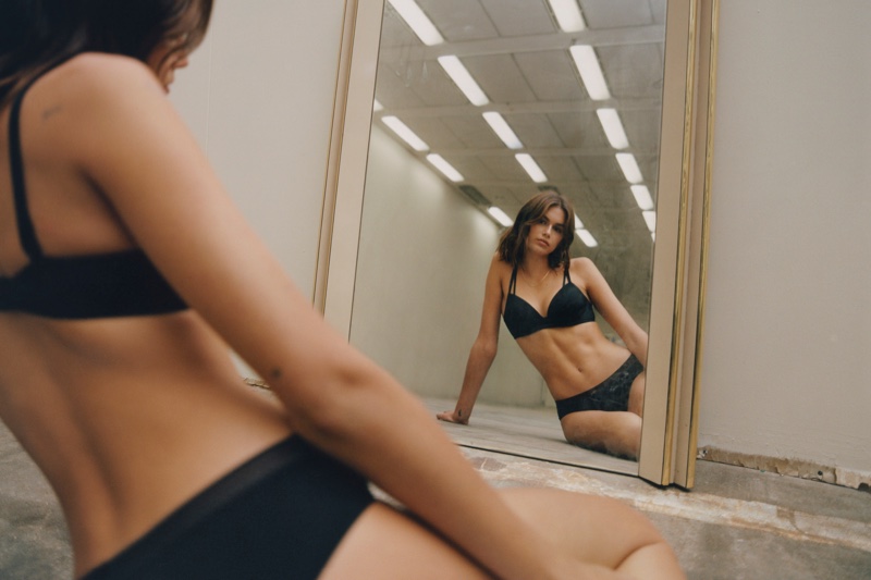 Posing in a mirror, Kaia Gerber wears underwear in Calvin Klein fall 2021 campaign.