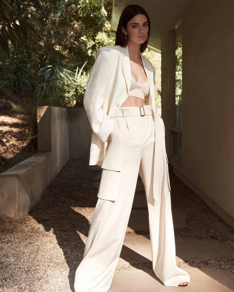 Dressed in a white outfit, Kendall Jenner wears a chic look for FWRD shoot.