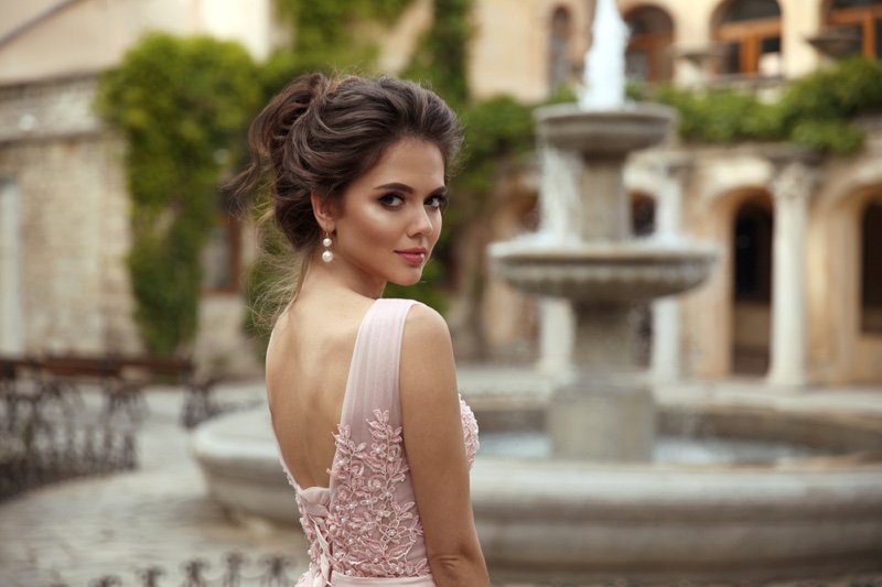 Model Back Pink Dress Earrings Makeup Hair