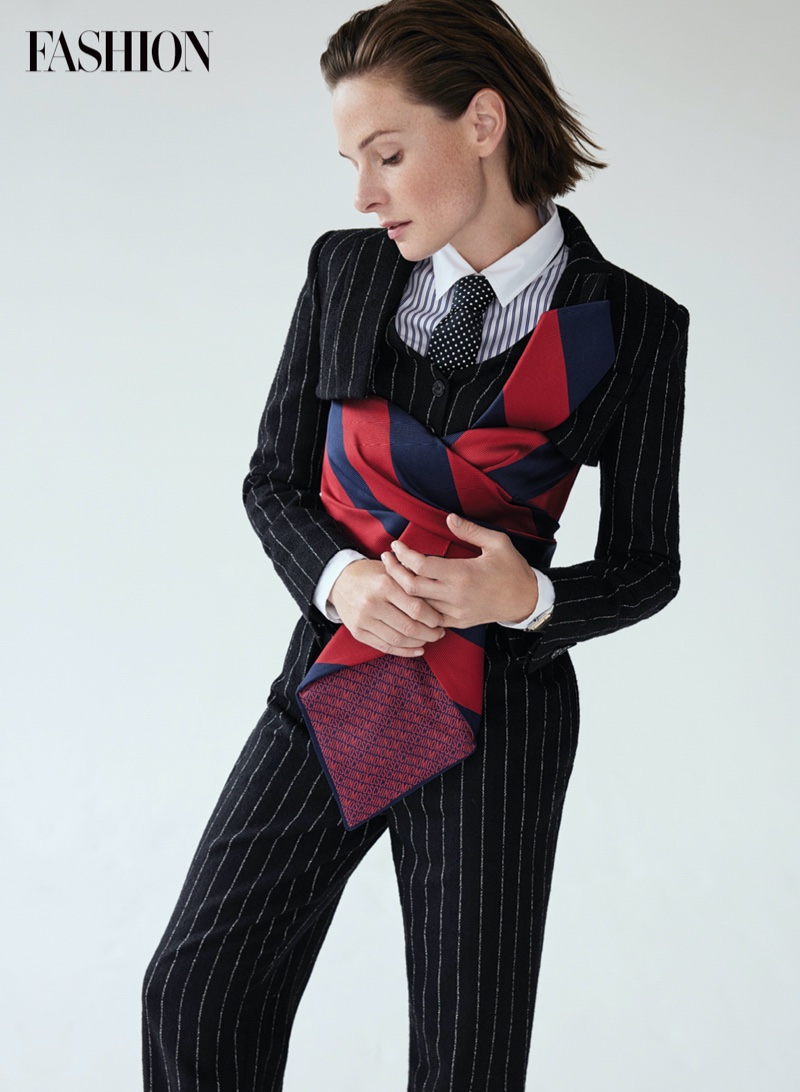 Rebecca Ferguson wears Moschino Couture suit, David Morris ring, and Cartier watch. Photo: Royal Gilbert / FASHION