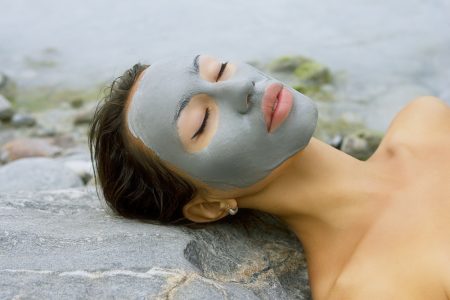 5 Benefits of Dead Sea Cream & How to Buy the Right One Woman Outside Wearing Mud Mask