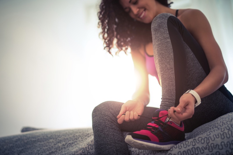 Woman Tying Sneakers Workout