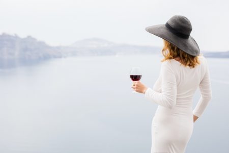 Leisure: Which Wines Should Be Chilled? Back Woman Holding Wine White Dress Hat