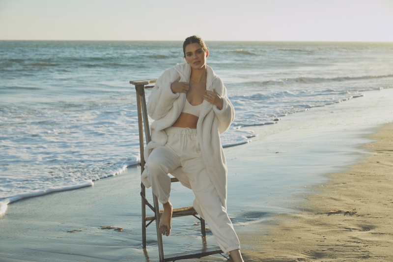 Dressed in white, Kendall Jenner layers up in Alo jackets & coats campaign.