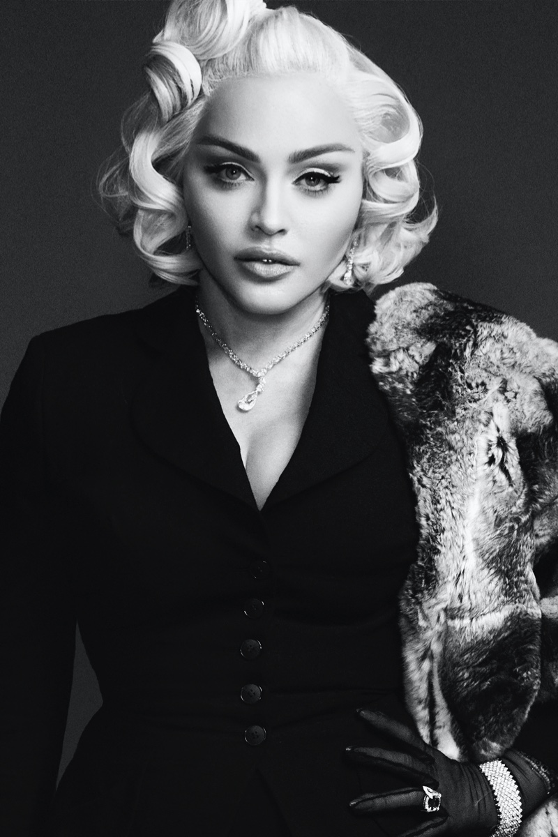 Photographed in black and white, Madonna wears jewelry from Bucherer Fine Jewellery with vintage stole and suit jacket, and Dita Von Teese for Gasper gloves. Image: Courtesy of V Magazine / Steven Klein