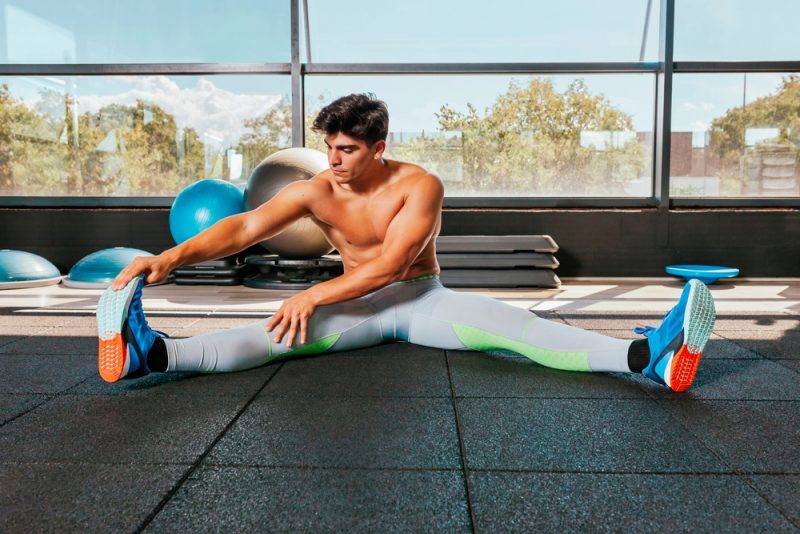 Man Wearing Leggings and Sneakers Gym