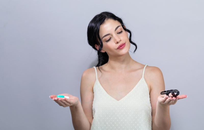 Model Holding Contact Lenses Glasses