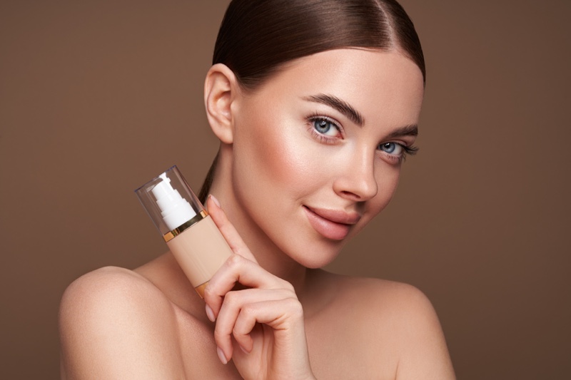 Model Holding Liquid Foundation Bottle Makeup