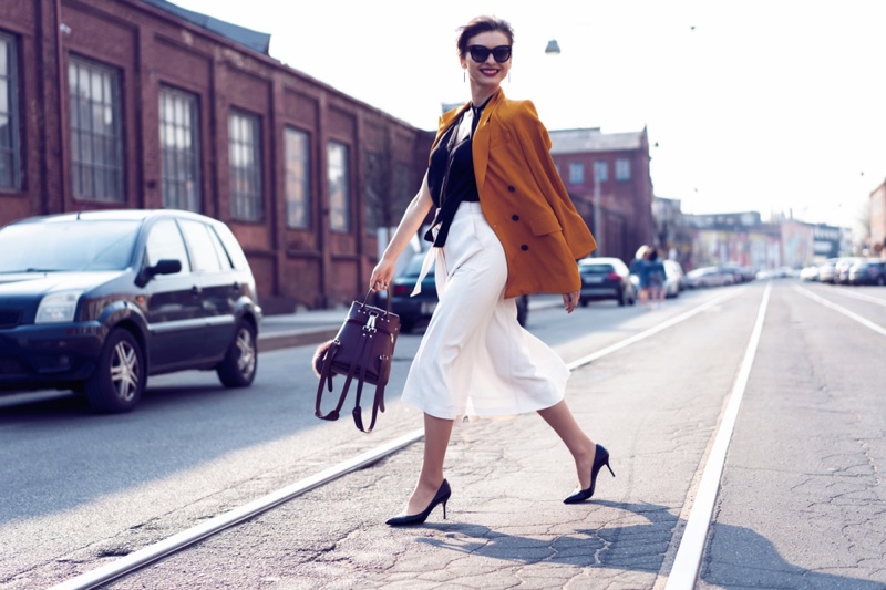Model Walking Street Orange Jacket White Skirt Heels