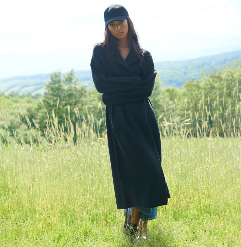 Posing outdoors, Jasmine Tookes appears in NAKEDCASHMERE NAKED in October 2021 campaign.