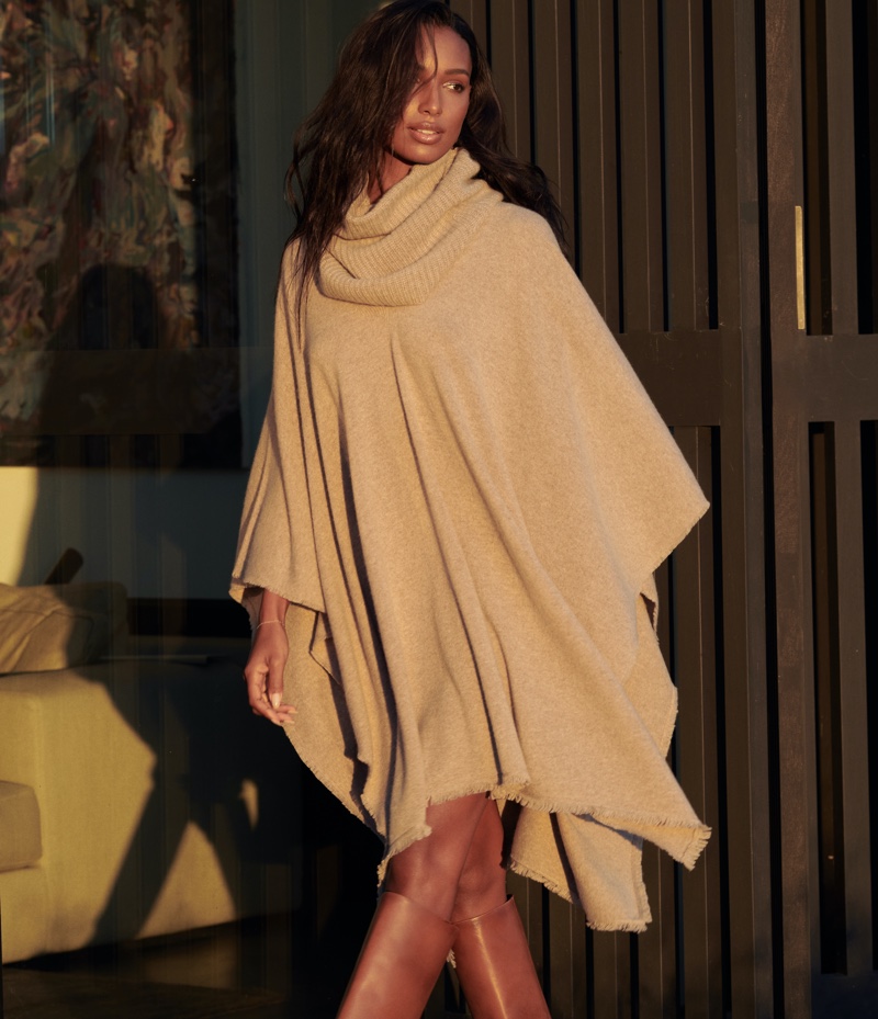 Wearing a poncho, Jasmine Tookes fronts NAKEDCASHMERE NAKED in October 2021 campaign.