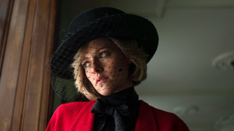 Wearing a black veiled hat and red tweed coat, Kristen Stewart plays Princess Diana in SPENCER. | Photo Credit: Pablo Larrín