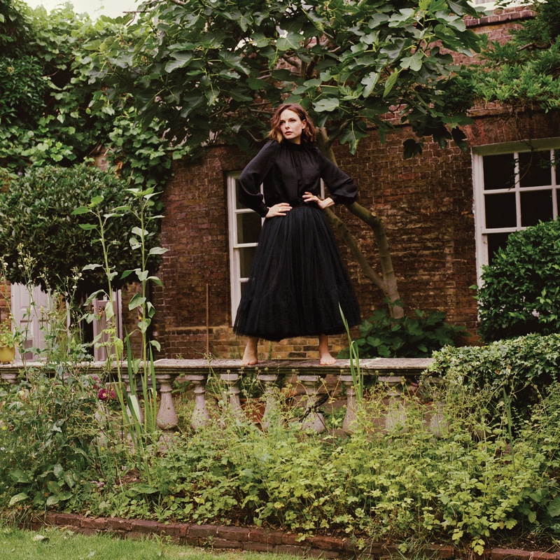 Striking a pose, Rebecca Ferguson wears a black outfit. | Photo Credit: Jo Metson Scott for WSJ. Magazine