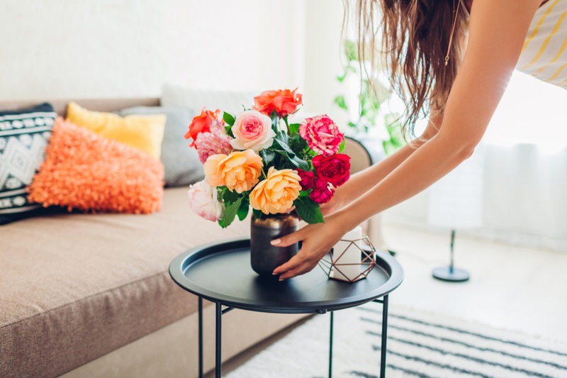 Woman Placing Flowers Home