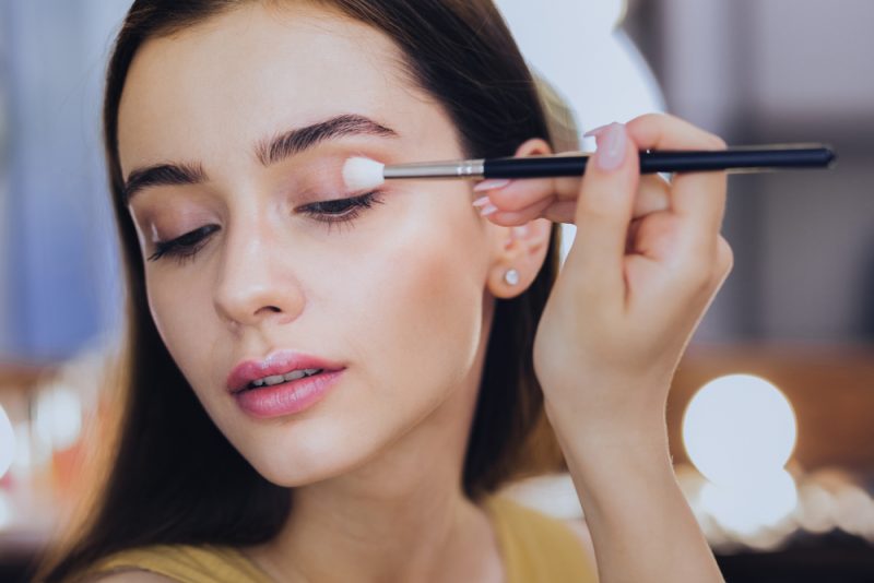 Woman Putting on Eyeshadow