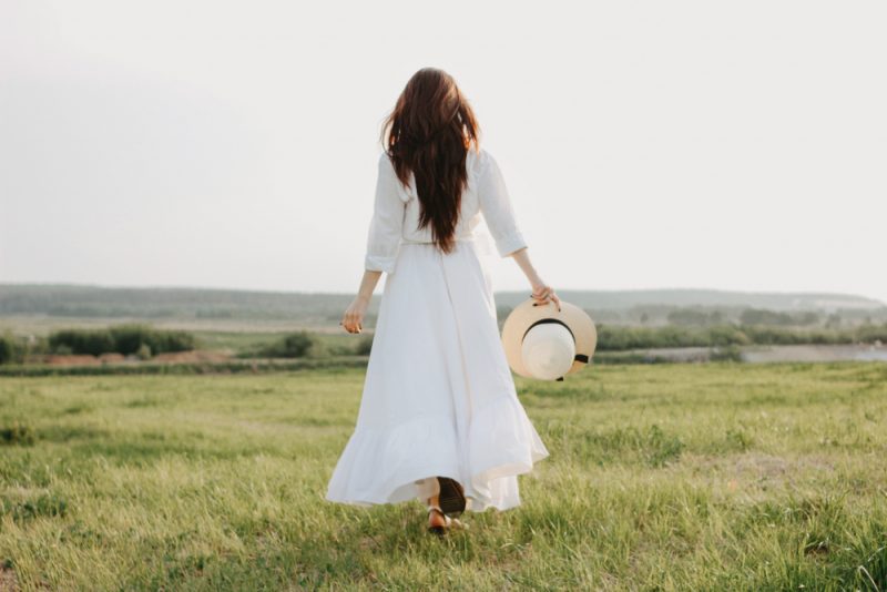 Woman with Chic Long Dress and Hat