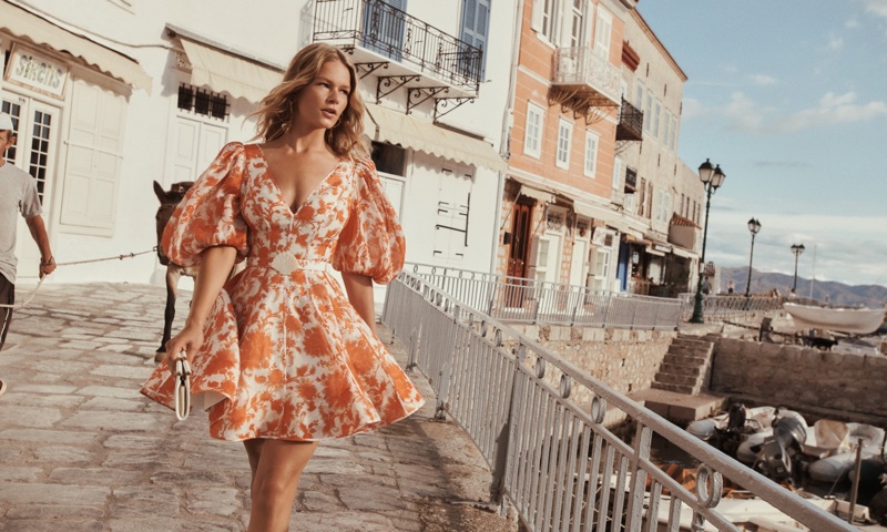 Zimmermann features puff sleeve mini dress in resort 2022 campaign.