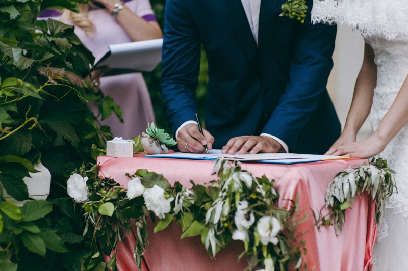 Bride Groom Signing Marriage Certificate