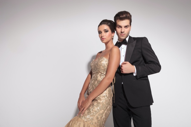 Couple Woman Gold Gown Man Tuxedo