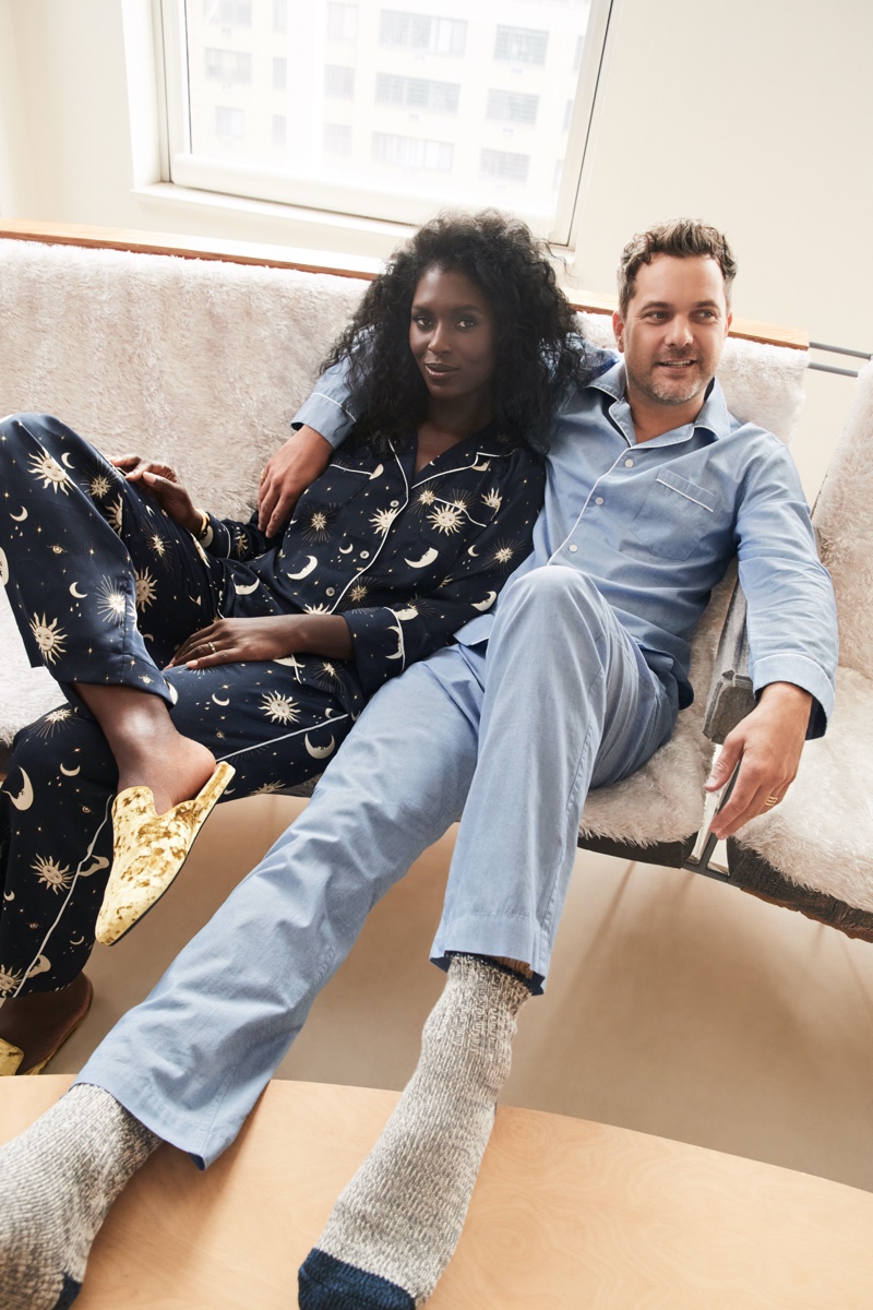 Wearing pajamas, Jodie Turner-Smith poses with husband Joshua Jackson in J. Crew Holiday 2021 campaign.