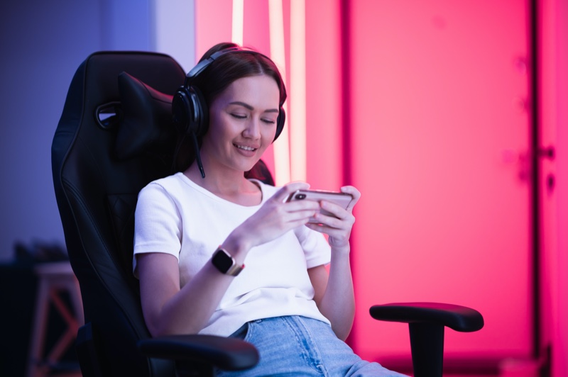 Smiling Woman Phone Game Gaming Chair