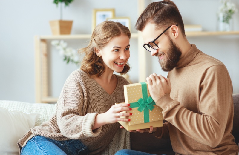 Woman Gifting Man Happy