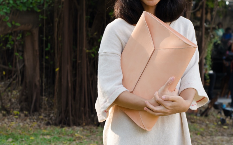 Woman Holding Big Oversized Clutch Bag