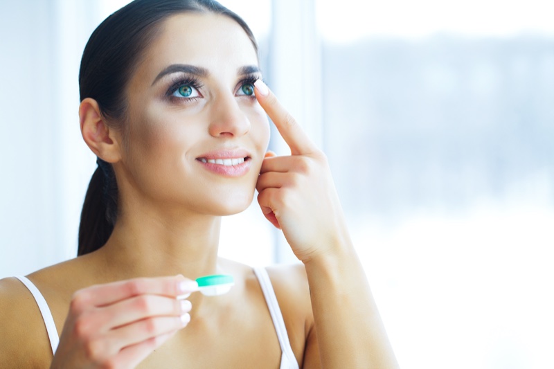 Woman Putting Contact Lenses Smiling