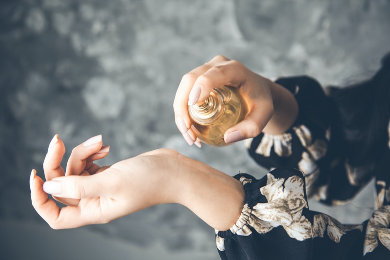 Woman Spraying Perfume Wrist